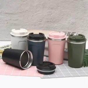 Dark-toned insulated tumbler set in a moody editorial lifestyle arrangement for slow coffee movement enthusiasts